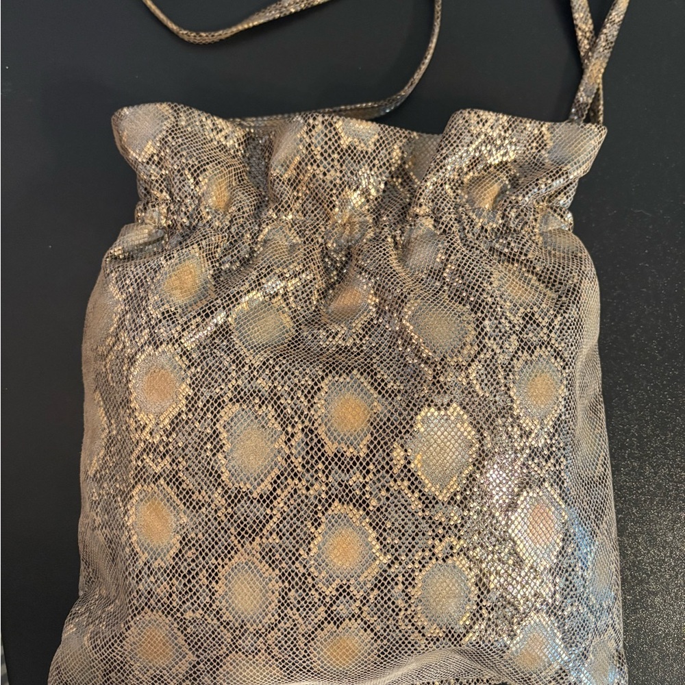 HOBO Gold and Black Crossbody Bag with Elegant Design